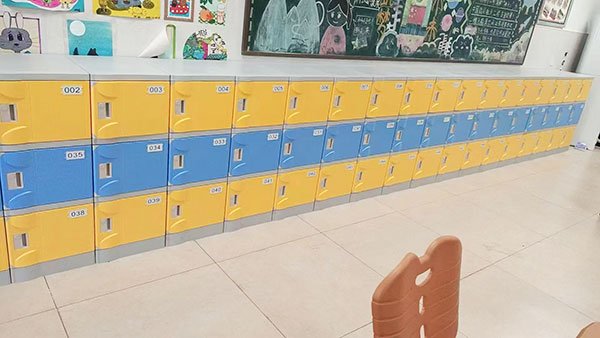 Low-profile waterproof plastic lockers installed in a primary school hallway 